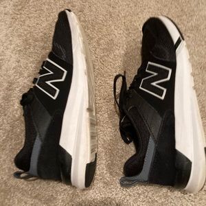 NEW BALANCE 009 black and white sneakers   Size 8 1/2. Comfort insert.